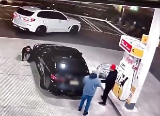 Attempted robbery caught on camera at a gas station: lookout in red beanie caught on camera