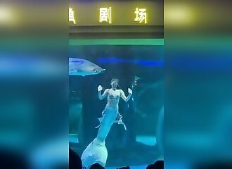 A giant sturgeon tries to swallow an animator dressed as a mermaid