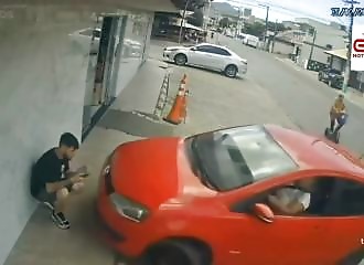 She misses her parking space and pins a pedestrian against the wall