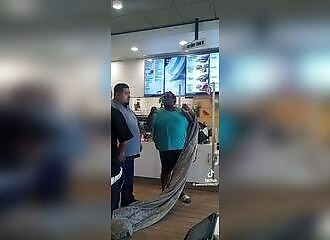A homeless woman dragging her blanket goes berserk when she is evicted from a McDonald's