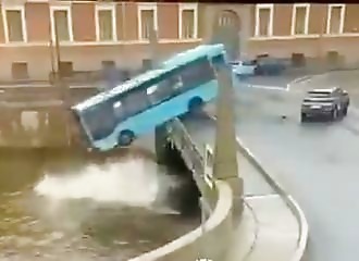An out-of-control bus collides with a car and plunges off a bridge into a river with 15 passengers on board, killing three