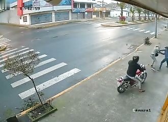 Two thieves think they're preying on a weakling in the street