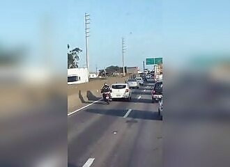 A biker loses his temper with a motorist, tries to block his path and ends tragically