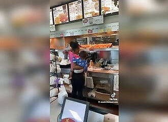 A mother helps herself at a fast-food counter and leaves without paying
