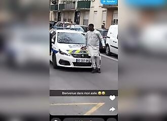 He blocks the police to allow a man on a motorcycle to escape