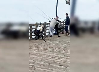 Things get out of hand between two fishermen on a California pier