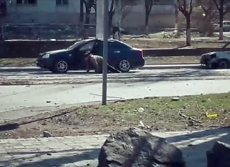 A civilian drives into a scene of war 