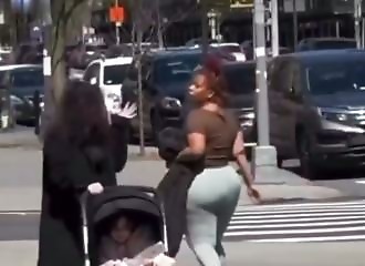 One woman spits at another for no apparent reason