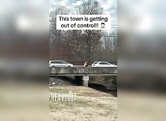 2 rednecks fall from a bridge during a brawl