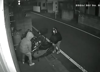A gang steals a scooter without even starting it.