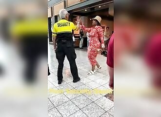 Woman violently punches elderly security guard