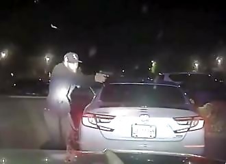 Suspect hit by police after shooting at officer (Warning - shocking)