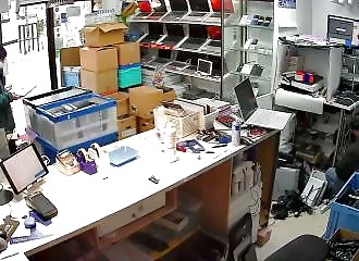 The nerve of him: He checks the price on his smartphone before stealing a PC!