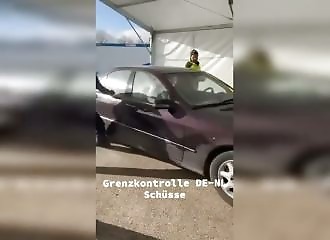 A motorist forces a border checkpoint and is riddled with bullets