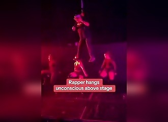 Awkward moment on live TV: Rapper hanging in mid-air collapses in front of the audience
