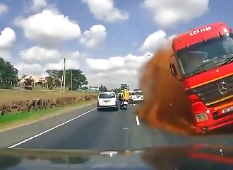 Terrifying dashcam footage of a runaway container trailer crossing the median barrier