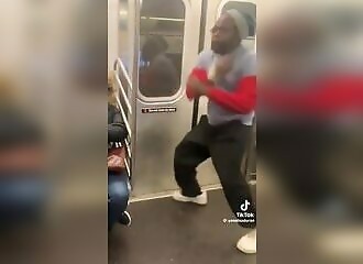 A madman in the metro pretends to hit other commuters