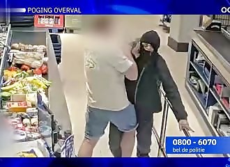The year's most botched robbery: the cash register wouldn't open, so a customer stepped in