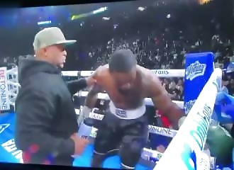 A boxer collapses unconscious in his corner between rounds.