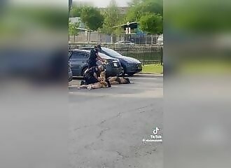 Two drunken, semi-naked women attack police officers in a parking lot, one receiving a 50,000-volt shock