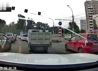 He cuts in aggressively, hits a car, and quickly changes his attitude as he gets out of the vehicle