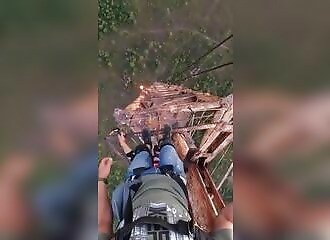 He jumps from a tower but his parachute catches on a cable