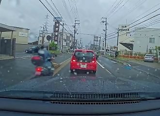 A motorcyclist crashes and his helmet takes the brunt of the impact