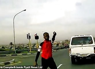 Motorist runs into carjacker to avoid being robbed