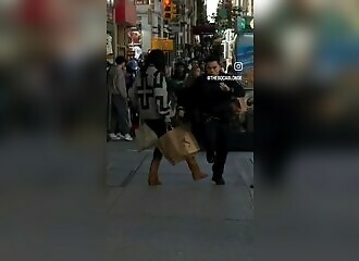 a woman tries to knock down a policeman in new york