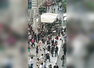 A woman is attacked because she is wearing the French flag