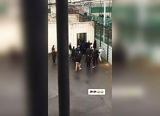 In France, a prisoner defends himself against a dozen assailants, and the guards seem to be having trouble calming the situation down